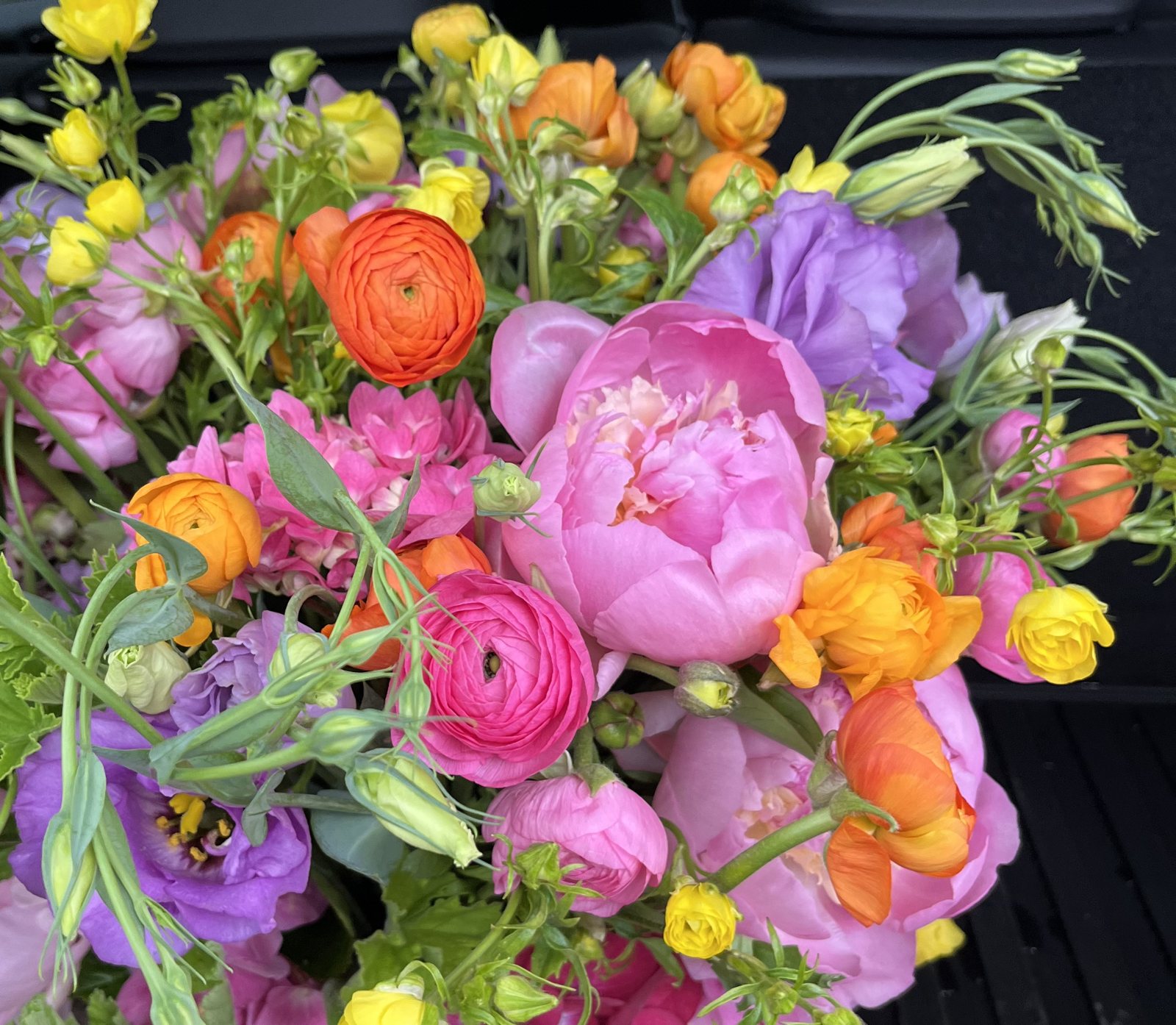 Peonies, ranunculus, and lisianthus in full color